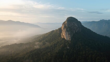 Mountain terrain with misty atmosphere highlighting elevation and landscape features