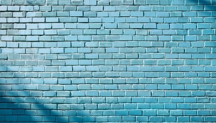 pale blue brick wall with textured surface in sunlight