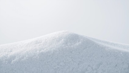 White snow surface with a snowdrift on a white background, suitable for layout and editorial headers