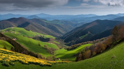 Rolling verdant hills cascade down toward a deep valley under a dramatic sky