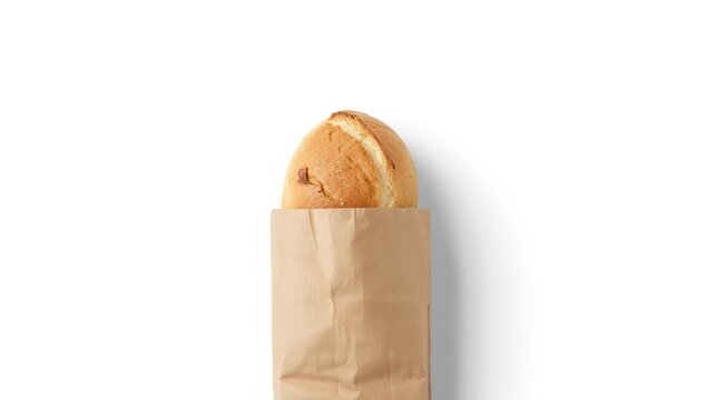 Packaged white bread loaf in paper bag set against white background for editorial or design purposes, bread packaging