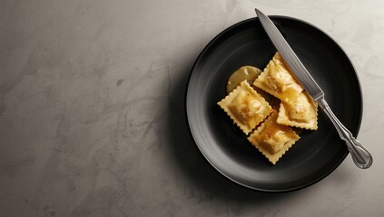 Filled Italian pasta served with butter sauce on dark plate, focusing on culinary craftsmanship, World Food Day