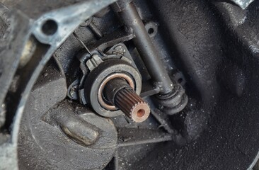 Worn out automotive clutch throw-out bearing close up. Broken transmission parts: defective clutch...