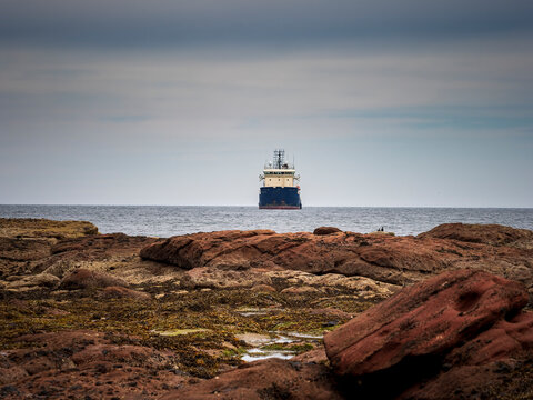 Ship navigating North Sea waters near Fraserburgh coastline