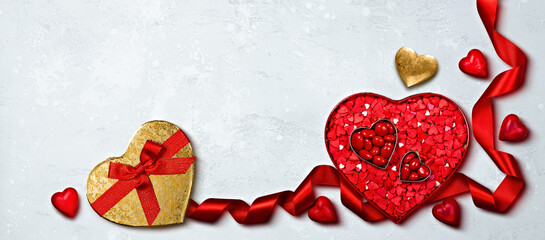 Valentine's Day Heart Decorations with Red and Gold Accents on Textured Background