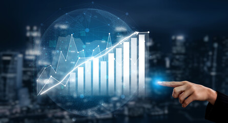 An engaging visual of a business growth concept with a hand pointing at a digital graph in a modern cityscape at night. Perfect for finance and technology themes. Impute