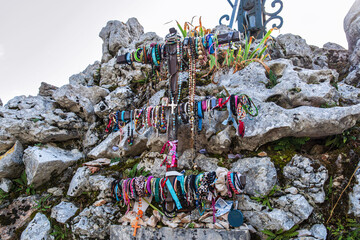 Jerusalem cross on which bracelets are hung to make wishes or prayers