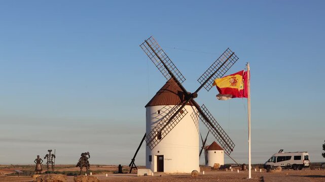Iconic white windmills of Mota del Cuervo with sculptures of Don Quixote and Sancho Panza