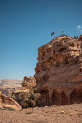 Vertical Rock Formation Outdoors in Wadi Musa. Red Sandstone Cliff in Petra. Stone Texture during Sunny Day in Jordan.