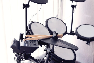 Modern electronic drum set with drumsticks