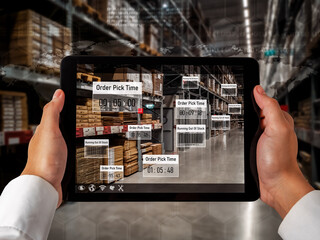Smart warehouse management system using augmented reality technology to identify package picking and delivery . Future concept of supply chain and logistic business .