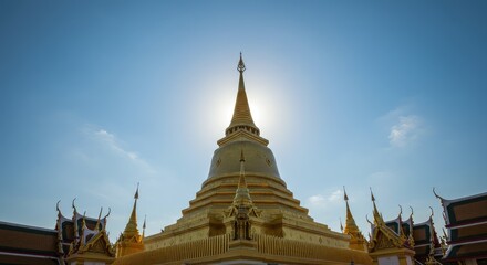 Fototapeta premium Golden Pagoda against a clear blue sky