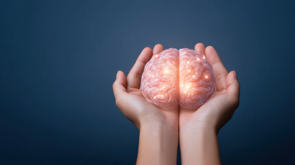 Human hands holding glowing brain model symbolizing intelligence and mental health care with dark blue background and soft lighting