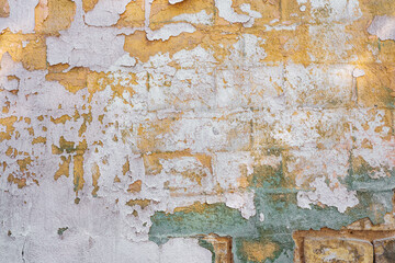 Old peeling paint on brick wall texture background