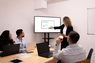 Business team presenting data analysis during meeting