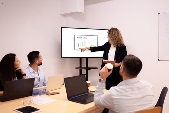 Business team analyzing results during corporate presentation meeting