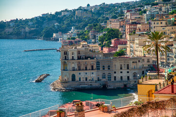 Scenic view of Mergellina seafront in Naples with calm sea and sunset colors