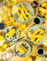 Yellow crepes with blueberries and lemons for breakfast