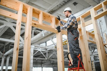 Construction new and modern modular house. Worker man in protective uniform wear working on building development industry of energy efficient property