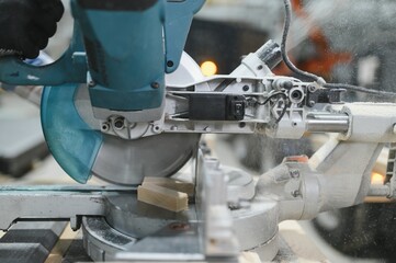 Closeup of wood cutting table with electric circular saw