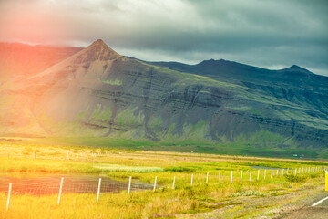 Peaceful Icelandic rural summer scene with grazing land, meadows, and bright skies