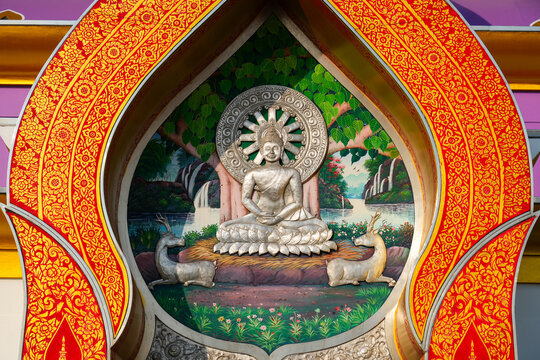 Intricate relief of Buddha&rsquo;s first sermon over the entrance of the crystal pagoda of Wat Tha Ton, a modern hilltop buddhist temple in Mae Ai District, Chiang Mai Province, Northern Thailand