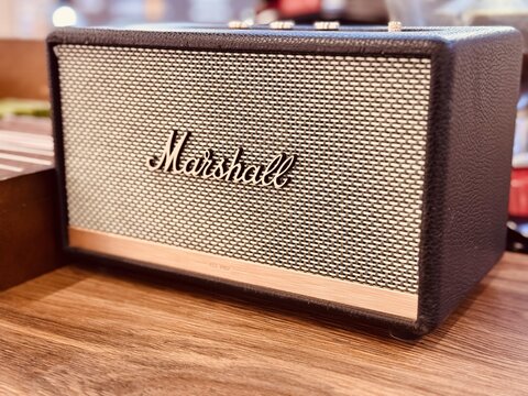 ASTANA, KAZAKHSTAN - October 25, 2024: Marshall Bluetooth portable wireless speaker stands on the counter of a mini coffee shop in a supermarket. A cozy atmosphere