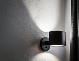 minimalist black wall sconce on a white concrete wall bright white light for a modern and bold look