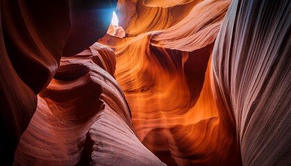 Obraz premium Majestic Antelope Canyon A Natural Slot Canyon With Vibrant Red Sandstone Formations Dramatic Light Beam Geological Wonder Travel Destination Earthy Tones Serene Beauty Abstract Patterns