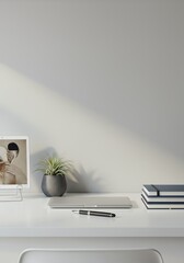 Minimalist Desk Setup with Laptop, Plant, and Art Print