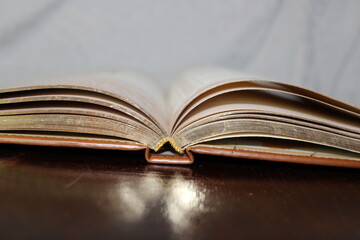 Aged Book Open on a Dark Surface