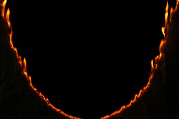 burning paper, glowing edge of paper on a black background.