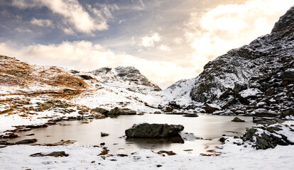 Bright Sun Hints Shines Around Mountainside Over