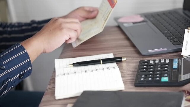 Viewing Bank Account Book in front of laptop, Account Statement, Money Number, Check Payment and Income, Financial Documents, Pay Slip, Cash Balance, Investment, Paper Page, Business