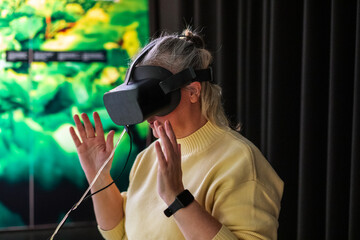 Engaging in virtual reality exploration in a modern tech space during a creative learning session