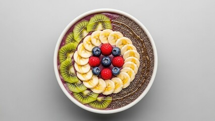 A beautifully arranged smoothie bowl topped with fresh fruits and chia seeds