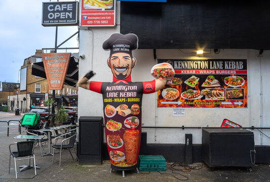 London, United Kingdom - December 28, 2025: Inflatable chef advertising a Kennington Lane Kebab shop on a city street of London.