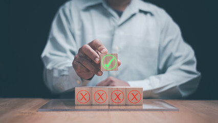 Business decision and quality control concept. Businessman choosing correct option with green checkmark over wrong choices. approval process, success evaluation, leadership and professional strategy.