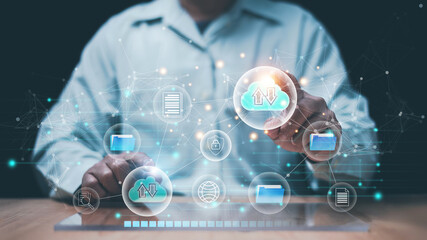 Cloud data management and digital file transfer concept. Businessman interacting with virtual cloud storage interface. Secure upload and download, cybersecurity and modern information technology.
