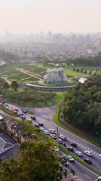 Sunset Botany Garden In Curitiba Parana Brazil. Drone Captures A Garden With Sidewalks Surrounded By Lush Trees. Building Industry Skyline Birds View Amazing. Industry Cityscape Birds View.
