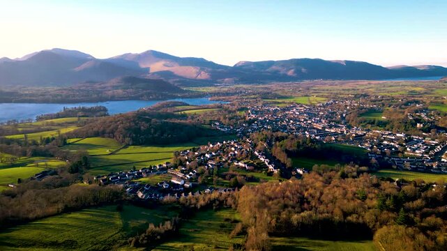 Aerial of small mountain town at sunset - Keswick, Cumbria
