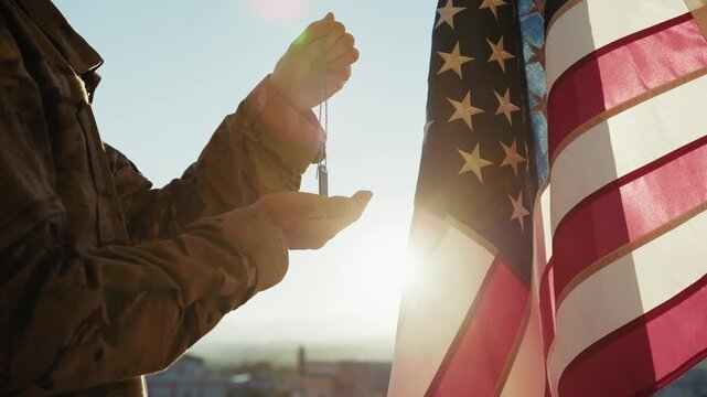 Dog Tag of a USA Army Soldier in Front of the Flag on Memorial Day