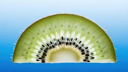Close up of a kiwi slice against a gradient background food photography concept