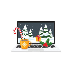 A festive laptop displays a snowy scene with a mug and candy cane on the keyboard during Christmas.