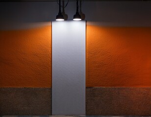 a small vertical white wall lit by two bright orange spotlights resting in an intimate gallery with dark stone tiles and moody shadows