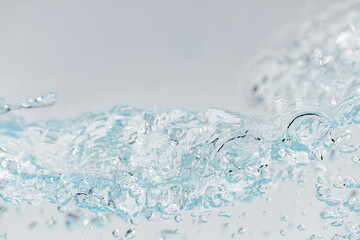 Closeup Transparent blue clear water surface texture with ripples. Abstract​ of​ surface​ blue​ splashes and bubbles​ water waves  reflected​ with​ sunlight​