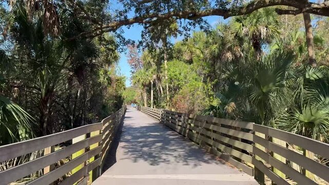 Riding along the linear trail near the zoo in Melbourne of Brevard County, Florida. 