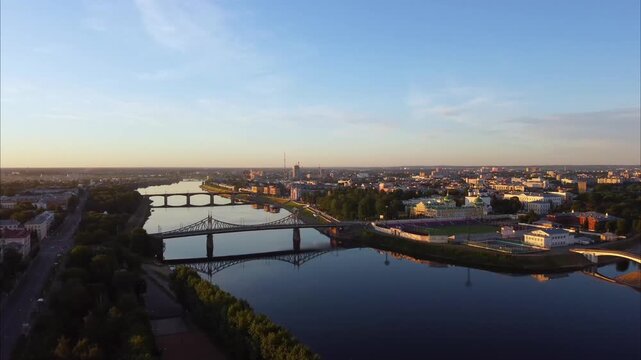 Drone flies over the Volga River in Tver. Aerial views show the city, bridges across the river, a cathedral, the river embankment, and other landmarks from above.