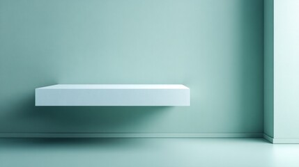 Minimalist interior setting features a single floating white shelf against a soft greenish blue wall