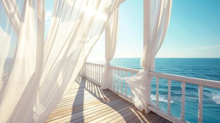The sundeck of a seaside resort is dd with white curtains creating a dreamy atmosphere as they sway in the wind.